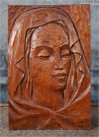 A Mid Century Carved Wood Plaque of a woman
