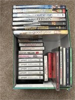 Box of DVDs CDs and cassette tapes