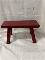 Small little red stool or kids bench. 14”