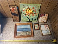 Assortment of nature themed art with frames