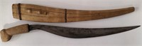 Primitive sword with wooden handle and scabbard