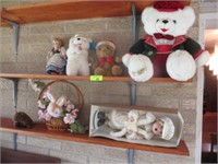 All dolls and stuffed animals on wall