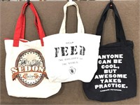 Three assorted canvas tote bags