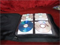 Binder full of DVD movies.