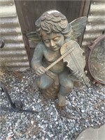 Robust cast iron outdoor decoration of cherub play