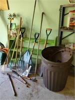 Trash can, garden tools, rakes, pruners, shovels,