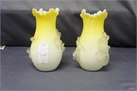 Pair of yellow art glass vases with flowers