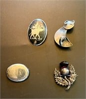 FOUR STERLING BROOCHES