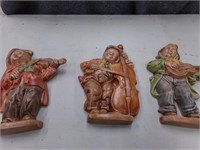 3 wall plaques of music players
