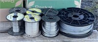 7 partial spools of smooth electric fence wire