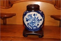 Chinese blue and white prunus urn with wooden