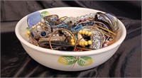 BOWL FILLED WITH JEWELRY