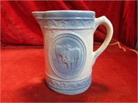 Antique salt glaze blue and white pitcher. Embosse