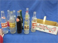 9 various soda bottles in fruit basket