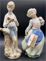 Pair of Casades Figurines, Boy with Book & Dutch