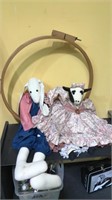 One large stuffed rabbit and a dressed cow doll