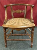 Walnut barrel back side chair with cane woven seat
