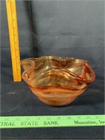 Orange and red colored glass bowl