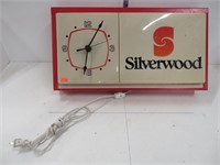 Silver woods clock sign, light works
