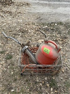 old milk wire crate, extension cord & gas can