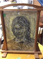 Wooden tabletop framed charcoal sketches by