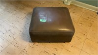 Brown leather footstool, 21 x 12H.