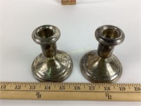 Pair weighted sterling candlesticks, one with