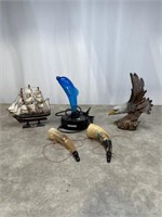 Small ship decor, eagle figurine, horns, and
