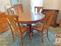 Oak round pedestal table With four splat back