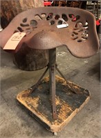 Antique tractor seat mounted to four wheel platfom