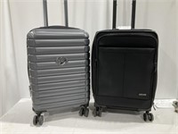 2 carryon sized suitcases, handle sticks on black