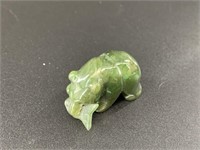 Alaskan Kobuk jade carved bear who has caught a la