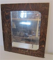 Wide Tiger oak frame beveled mirror. Measures 24"