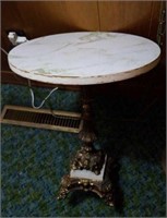 Small round table with brass ornate base