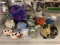 Assorted coin banks. Pigs and cows.