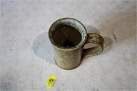 Vintage mug with man inside