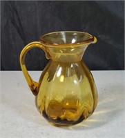 Amber glass pitcher approx 6 inches tall