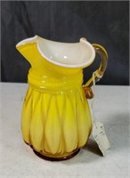 Bright yellow glass pitcher approx 5 inches tall