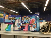 5 nib inflatable water soakers and posters.