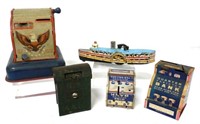 Lot of 4 tin banks & 1 cast iron boat