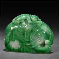 A CHINESE CARVED JADEITE ELEPHANT