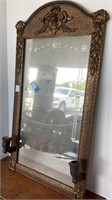 Antique mirror with ornate trim, 17x33