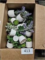 box of artificial small potted plants