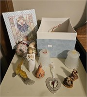 Box with knick knacks and ornaments. Angels,