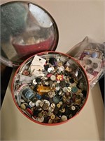 Round tin full of buttons