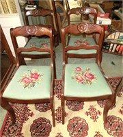 4 carved rose back needlepoint chairs