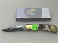 NIB Damascus folder pocket knife.