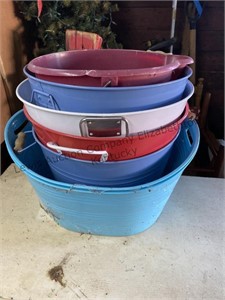 Stack of both plastic and metal tubs buckets