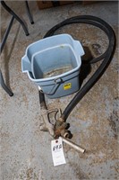 Gas Pump Nozzle with Hose and Blue Bucket