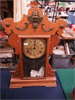 A Seth Thomas oak striking kitchen clock